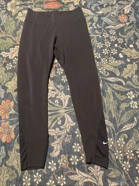 Nike Black women’s Performance Leggings with White Swoosh